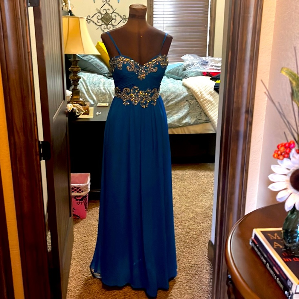 Gorgeous Blue, beautifully beaded gown. Strapless w open crisscross back.